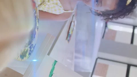 Animation of light trails over diverse schoolchildren painting Stock Footage 315218648