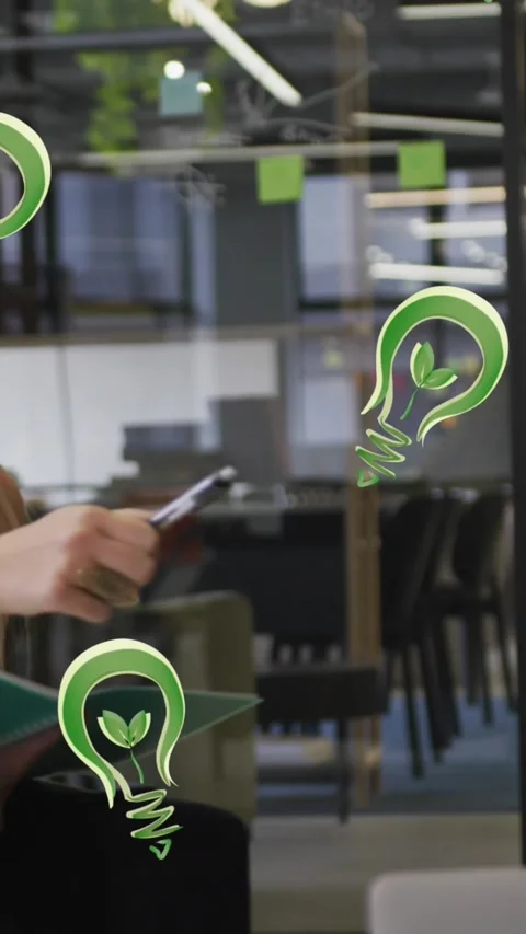 Animation of lightbulb icons over diverse business people wearing face masks and Stock Footage 342097941