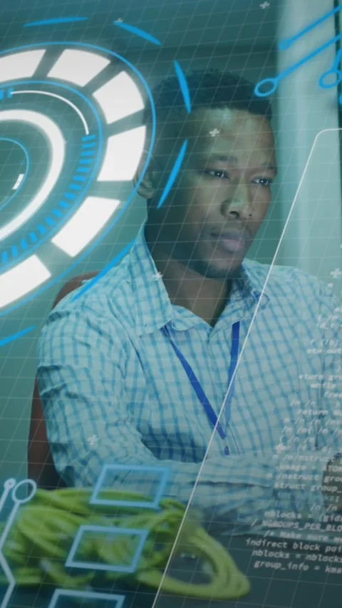 Animation of loading circles, computer language, african american man using Stock Footage 320983389