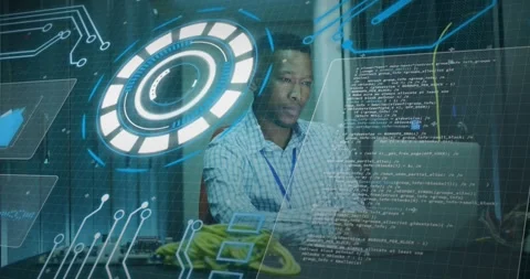 Animation of loading circles, computer language, african american man using Stock Footage 330297091