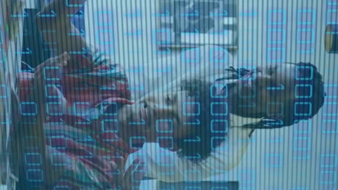 Animation of looping binary codes over diverse coworkers discussing reports on Stock Footage 314614781