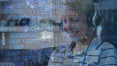 Animation of looping binary codes over smiling caucasian boy using laptop and Stock Footage 327277258