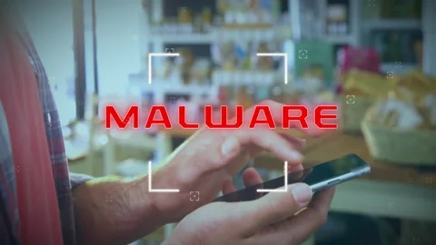 Animation of malware text over caucasian man using smartphone Stock Footage 307737371