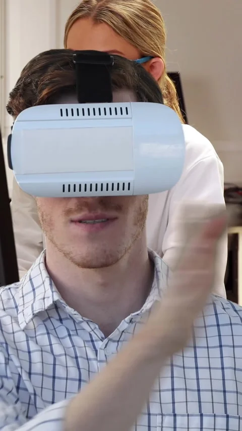 Animation of man wearing vr headset over female scientist using computer Stock Footage 343920458