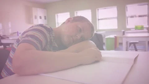Animation of math formulas over tired caucasian boy lying on desk at school Stock Footage 330590595
