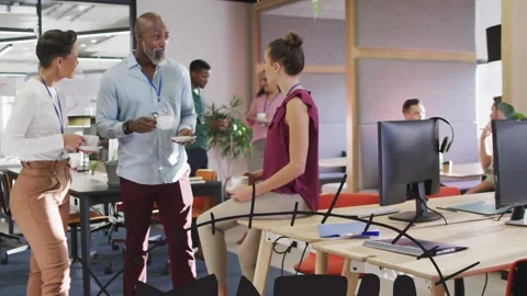 Animation of math text over diverse business people in office Video stock 327358650