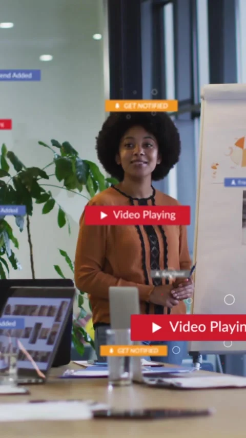 Animation of media icons over diverse colleagues discussing work in office Stock Footage 320280010