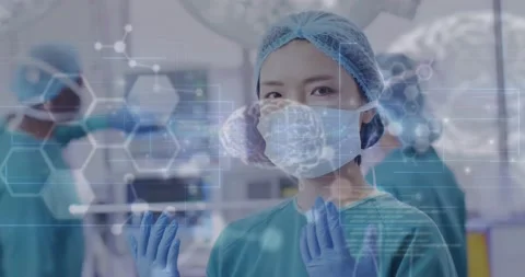 Animation of medical data processing over portrait of asian female surgeon in 스톡 동영상 233644225