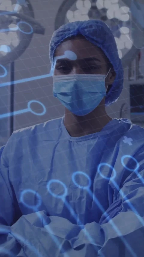 Animation of medical data processing over female surgeon in face mask Stock Footage 342915823