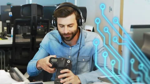 Animation of microprocessor connections over caucasian male photographer holding Stock Footage 229432560