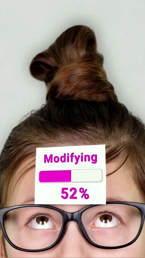 Animation of Modifying process takes place on the sticker. A smart teenager face Stock Footage 313730927