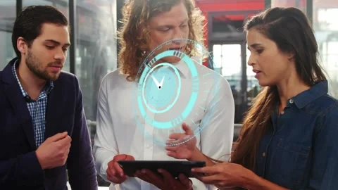 Animation of moving clock over diverse business people using tablet Stockbeeldmateriaal 330171863