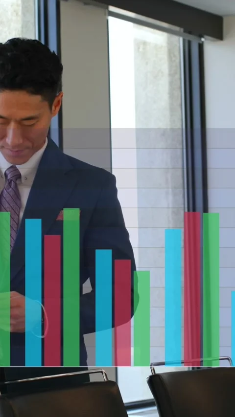 Animation of multicolored bar graphs over asian man standing and scrolling on Stock Footage 344746069