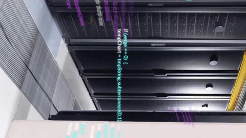 Animation of multicolored computer language over data server racks in server Video stock 312977830