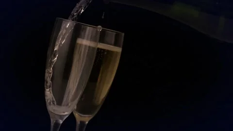 Animation of multicolored dots forming abstract pattern over champagne getting Stock Footage 330735458