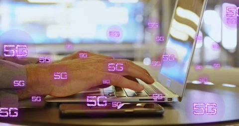 Animation of multiple 5g texts over cropped hands of caucasian man working on Stock Footage 329561125