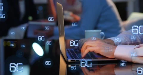 Animation of multiple 6g texts over cropped hands of caucasian man working on Stock Footage 329775679