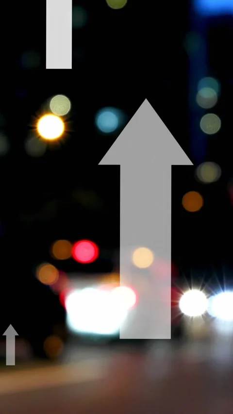 Animation of multiple up arrows over blurred vehicles moving on street in city Stock Footage 320811784