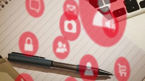 Animation of multiple digital icons against close up of pen, notepad and laptop Stock Footage 255106005
