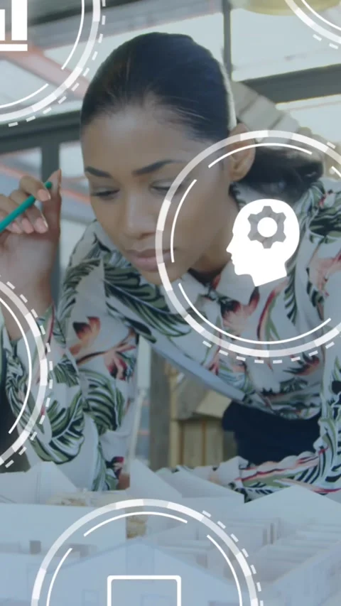 Animation of multiple digital icons against woman working on a model plan at Stock Footage 341927383