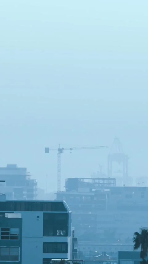 Animation of multiple graphs, map and loading bar over modern buildings against Stock Footage 343829003
