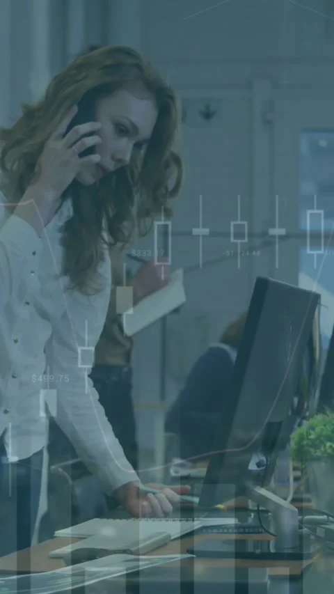 Animation of multiple graphs over caucasian coworkers looking into computer and Stock Footage 344766095
