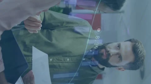 Animation of multiple graphs over multiracial coworkers discussing report in Stock Footage 313017764