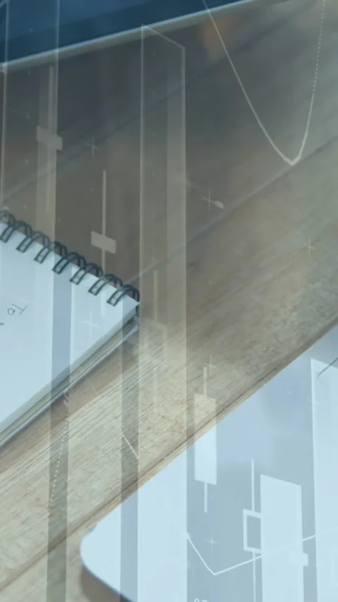 Animation of multiple graphs, overhead view of caucasian man writing in notepad Video stock 344723428