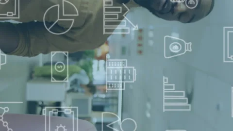 Animation of multiple icons over diverse coworkers discussing while walking in 動画素材 312899329