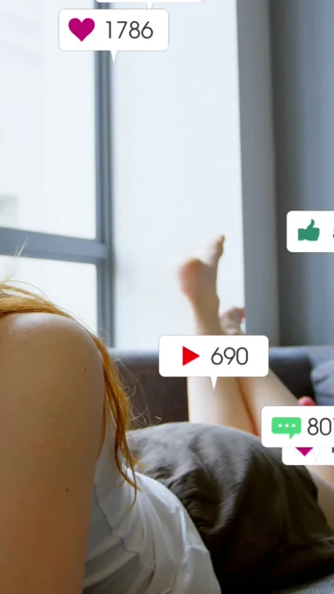 Animation of multiple notification bars over caucasian girl lying on bed and Stock Footage 323578668