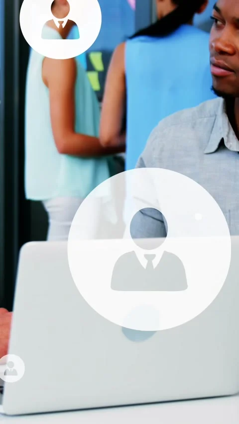 Animation of multiple profile icons over diverse entrepreneurs sharing ideas in Stock Footage 344783902