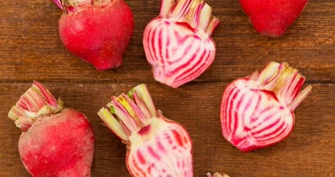 Animation of multiple red beetroots on wooden background Stock Footage 170563551