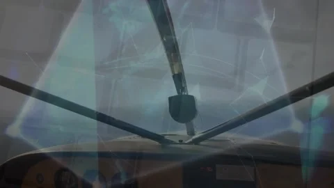 Animation of multiple texts over rotating globe against cockpit view of flying Stock Footage 326032494