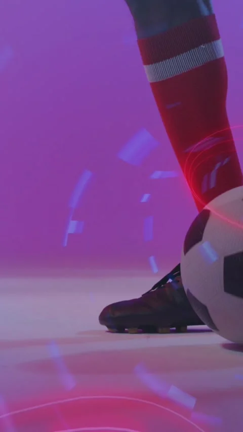 Animation of neon pattern over african american footballer kicking ball Stock Footage 343641027