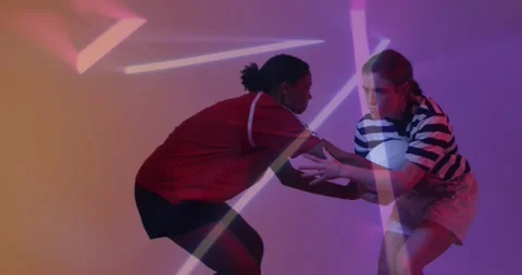 Animation of neon pattern over female rugby players on neon background Stock Footage 328090546