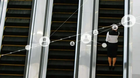 Animation of network of connections with icons over businesswoman on escalator Stock Footage 159178777