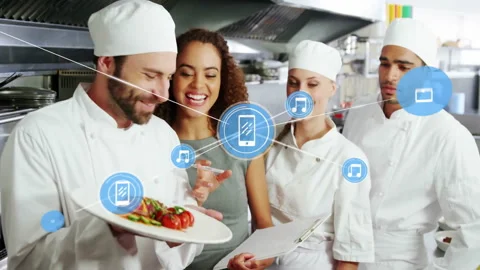 Animation of network of connections with icons over diverse cooks in kitchen Stock Footage 309975132