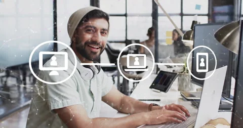 Animation of network of connections with icons over diverse colleagues working Stock Footage 310303554