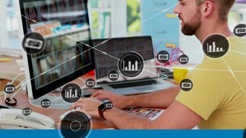 Animation of network of connections with icons over businessman using computer Stock Footage 328522741