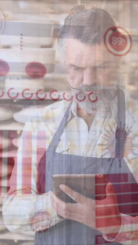 Animation of network of connections with icons over man using tablet Stock Footage 343779600
