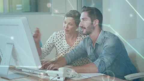 Animation of network of connections over business people using computer Stock Footage 330469331