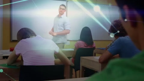 Animation of network of connections over caucasian male teacher and diverse Stock Footage 327784860