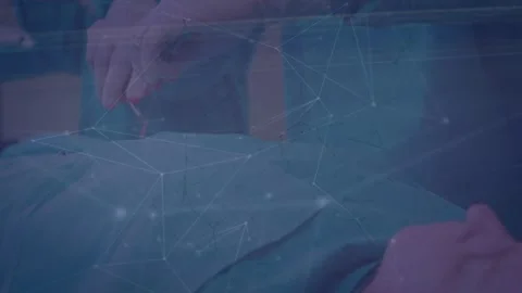 Animation of network of connections over couple paying online using laptop 库存影片 326038074