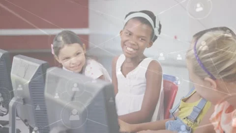 Animation of network of connections over happy diverse pupils using computers at Stock Footage 330728085