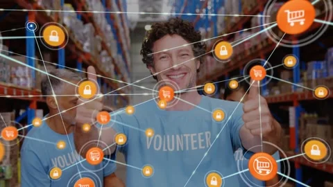 Animation of network of digital icons over caucasian male volunteer showing Video stock 329971811