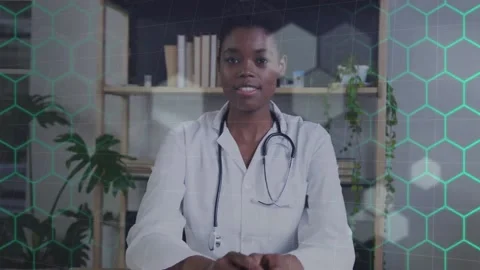 Animation of network of hexagons over african american female doctor Stock Footage 234473750