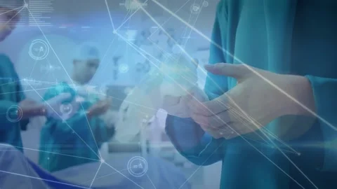 Animation of network lines with medical data over surgeons preparing for surgery Stock Footage 330247944
