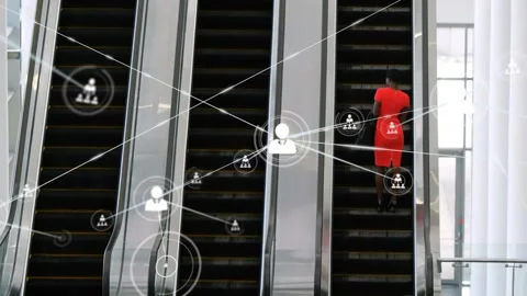 Animation of network of profile icons over rear view of businesswoman on Stock Footage 330344384