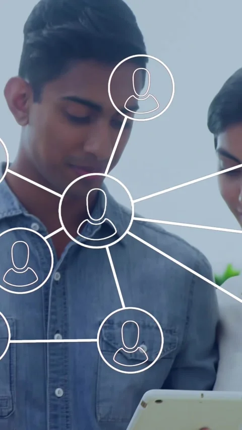 Animation of network of profile icons over diverse man and woman discussing over Stock Footage 344775242