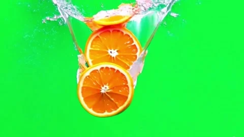 Animation orange slices with water splash bright light on green screen. Stock Footage 281219085